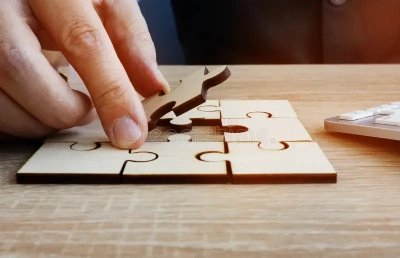 business success problem solving man holds piece puzzle concept 131649246 1